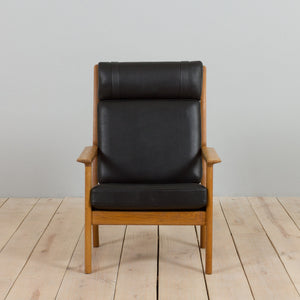 Hans Wegner – GE 265 lænestol for Getama, eg & sort læder, 1970/80'erne