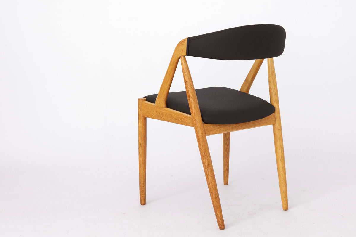 Kai Kristiansen – Model 31 stol i bøg, nybetrukket med sort skai