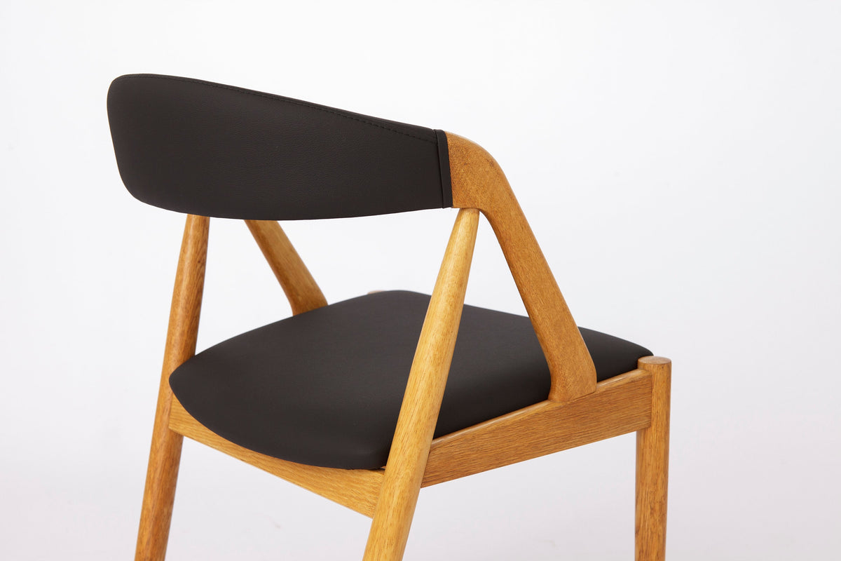 Kai Kristiansen – Model 31 stol i bøg, nybetrukket med sort skai