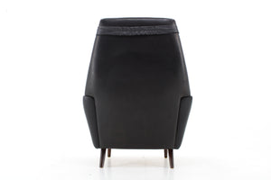 Lænestol i sort læder med høj ryg, dansk design
